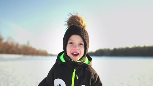 Winter Time Happiness Childhood Happy Boy Play in a Beautiful Winter Park Cute Kid Having Fun at