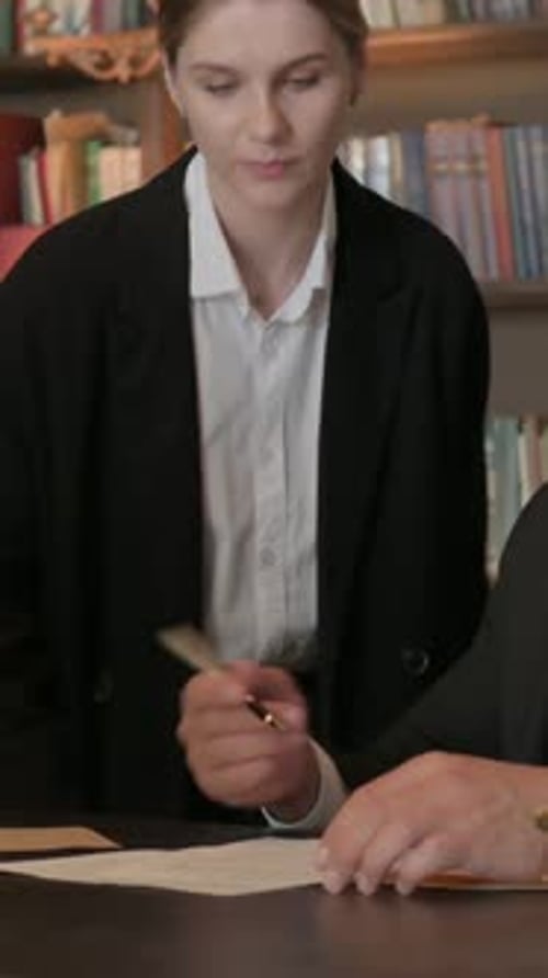 Team of Lawyers Signing Legal Documents in Office, vertical