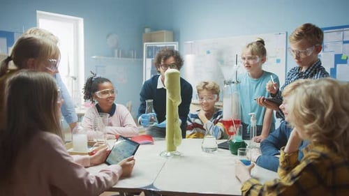 Elementary School Science / Chemistry Classroom: Enthusiastic Teacher Shows Funny Chemical Reaction