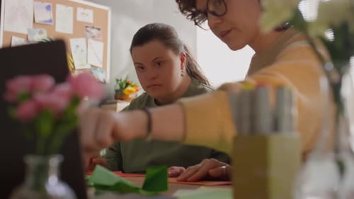 Woman Crafting With Friend At Home