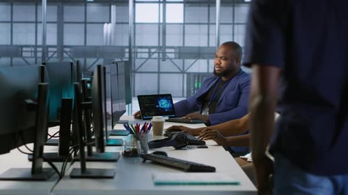 Technician Entering Data Center Tuning Music on and Starting Work on AI
