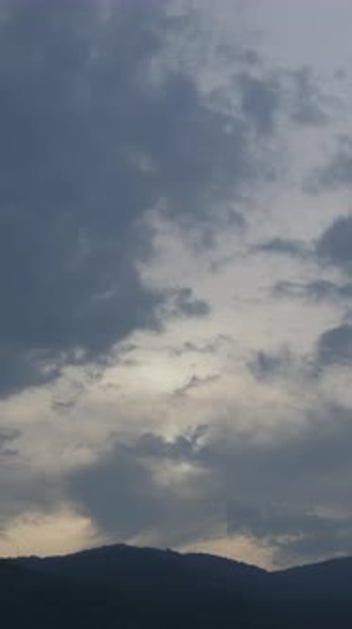 Time Lapse of Clouds Flowing Over Mountains