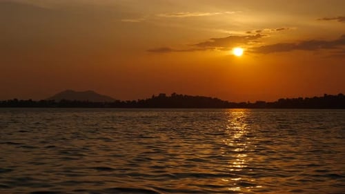 Evening Lake Between Small Hills