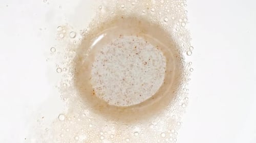 Closeup Effervescent Tablet Aspirin Vitamins on a White Background Macro Shot of Fine Air Bubbles in