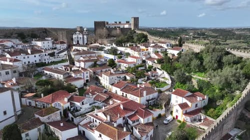 Obidos Skyline. Historic City Scenery. Medieval Architecture. Walls Of Castle Construction.
