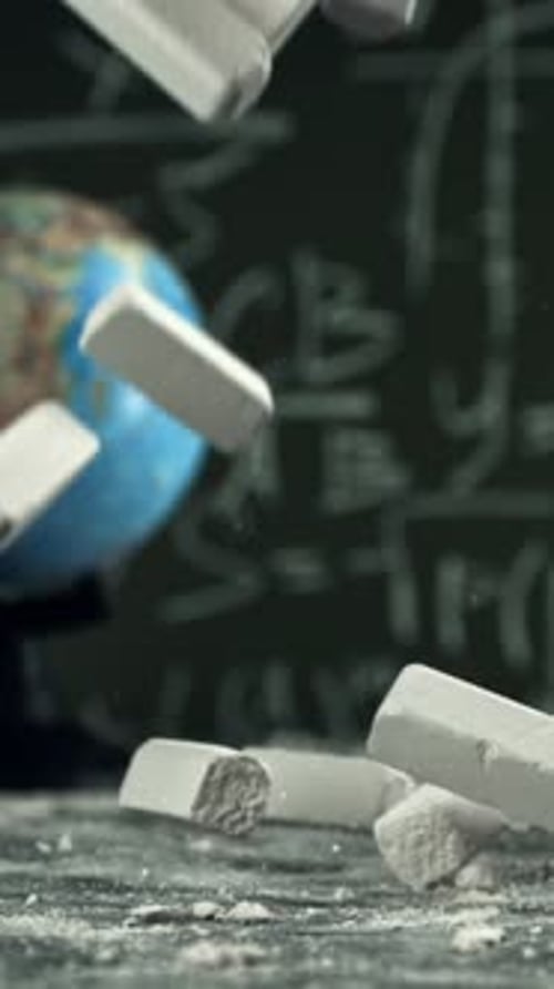 School Chalk Falls on the Desk Filmed on a Highspeed Camera at 1000 Fps