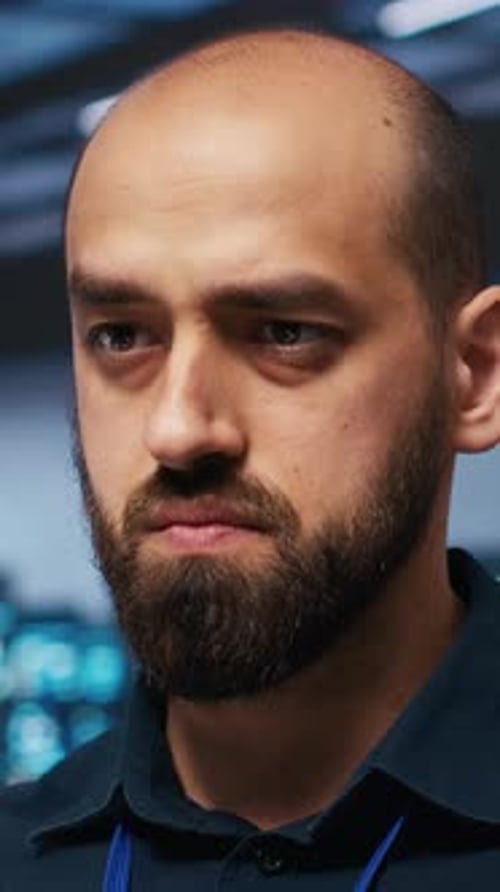 Vertical Video Close Up Shot of IT Engineer Safeguarding Supercomputers Against Threats