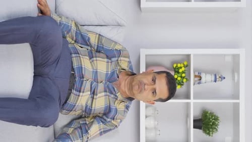 Vertical video of Nervous old man.