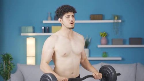 Man Lifting Weights at Home for Fitness