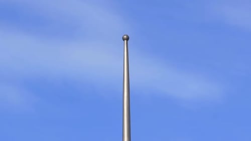 tip of the pole of flag in a sunny day mast