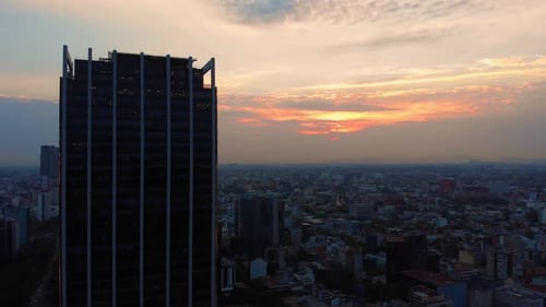 aerial shot sunrise Mexico City landscape tall buildings cloudy sky