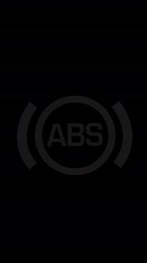 Vertical video. Flashing Yellow ABS Icon Warns of an Issue with the Anti-lock Braking System,