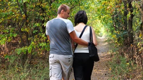Couple Walking Along Path at Summer Forest Happy Pair Going Along Trail at Wild Woodland Lovers