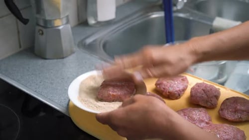 Woman Cooking Meatballs or Meat Patties Cutlets Frying with Oil