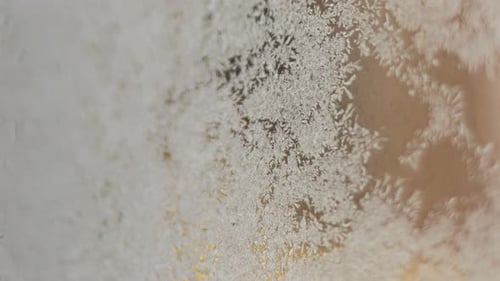 Frosty Window with Intricate Ice Crystal Patterns