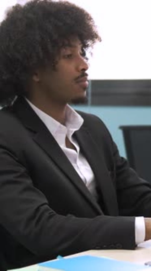 Man In Suit Thinking in Office Environment