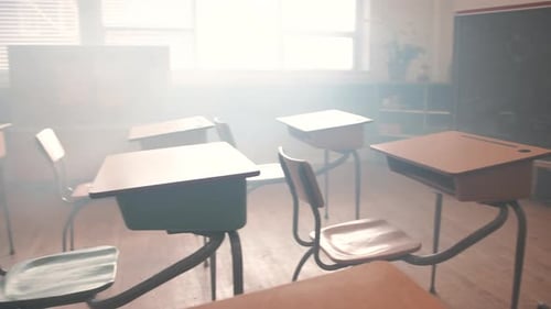 Empty Classroom Desks and Chairs in Bright Sunlight