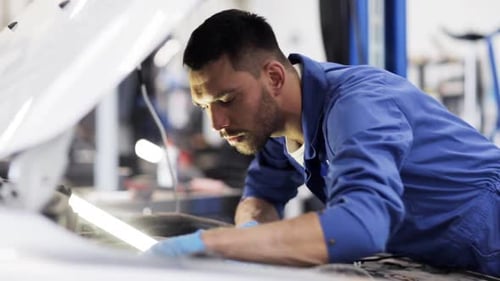 Car Service, Repair, Maintenance and People Concept - Mechanic Man with Wrench