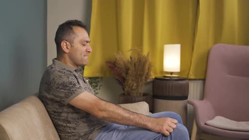 Man slapping himself with a nervous breakdown.