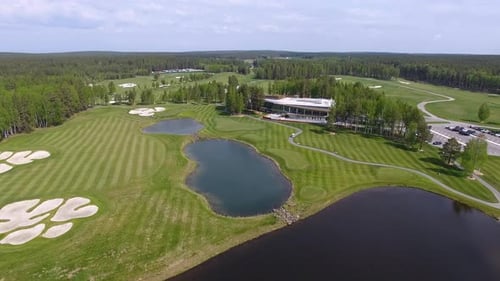 This is an Aerial View of a Beautiful and Scenic Golf Course Featuring Various Water Features