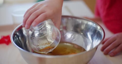 Young Child Baking at Home in Kitchen
