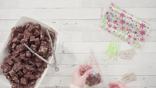 Chocolate Fudge Placed Into Holiday Gift Bags