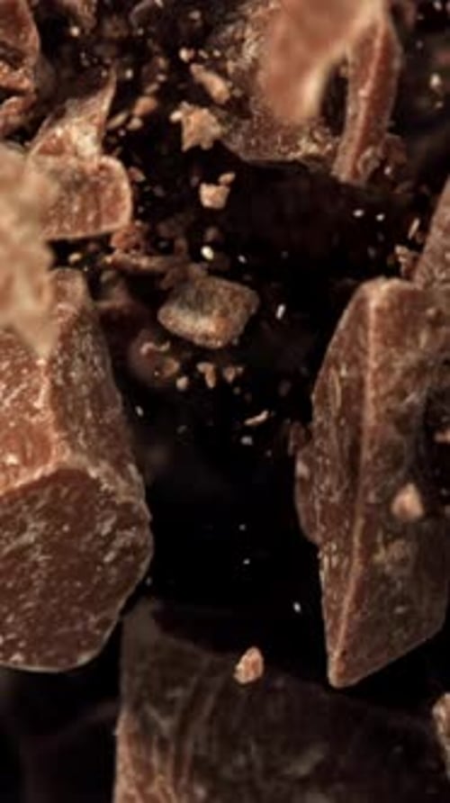 Super Slow Motion Pieces of Dark Milk Chocolate Filmed on a Highspeed Camera at 1000 Fps