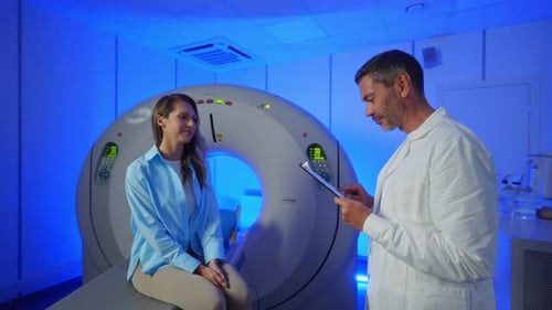 Medical Worker Explaining CT Scan Results to Patient in Hospital Setting MRI Machine and