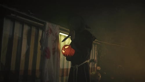 Hooded Figure with Jack-o-Lantern and Bloody Man
