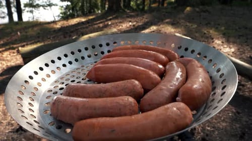 Sausages Cooking on a Grill Outdoors