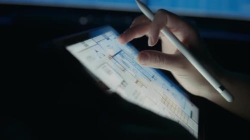 Hands Drawing Floor Plan on Tablet with Stylus