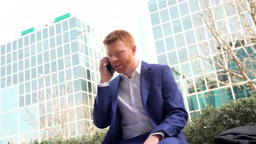 Successful Young Man Celebrates on His Cellphone