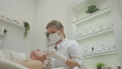 Facial Treatment by Professional Cosmetologist in Clinic