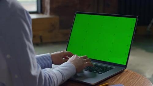 Unrecognizable Woman Typing on Green Screen Laptop