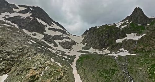 Ancient Snow Glacier Among High Mountains The Peaks of the Mountains are Covered with Snow