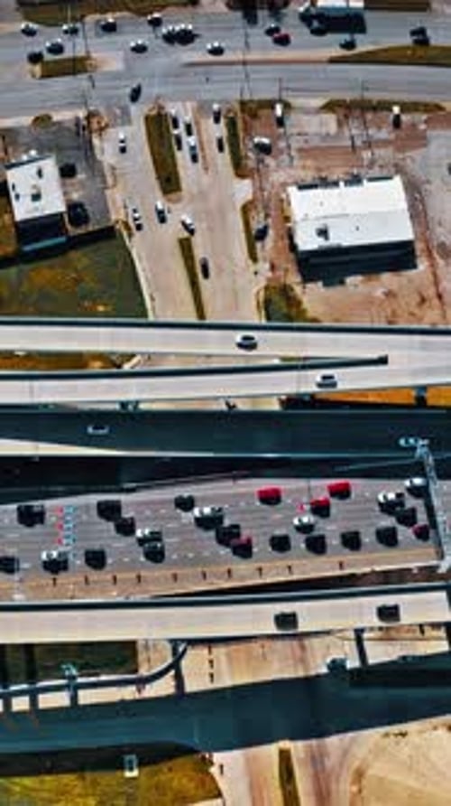 Aerial view of busy highways and parking lot in Dallas, USA