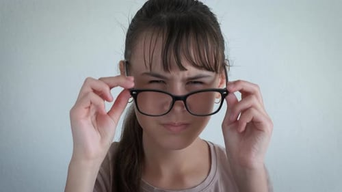 Girl Removes Glasses For Closer Look