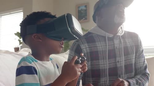 Child and Man Enjoying Virtual Reality Headsets