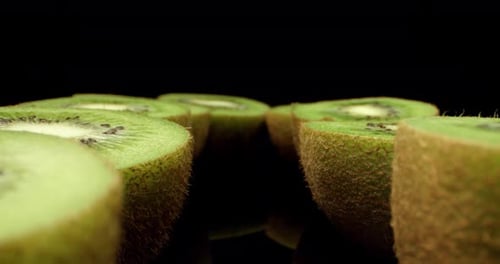 Juicy fresh green kiwi fruit cut in half super close up shoot fly over laowa k4 high quallity