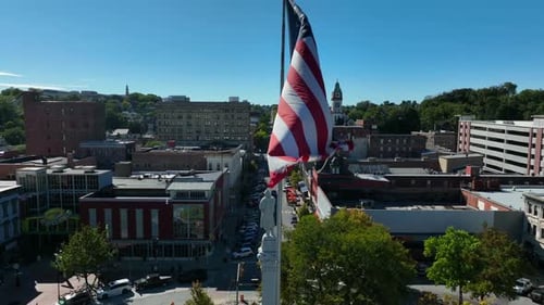 Aerial View of Small Town With American Flag