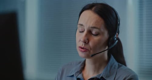 Woman Wearing Headset Working in Office