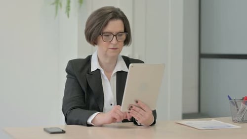 Adult Woman Makes Video Call on Tablet
