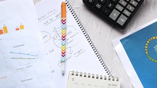 Financial Graph Calculator and Notepad on Table