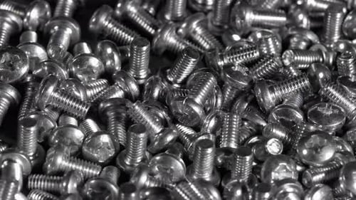 Pile of Silver Screws Close Up
