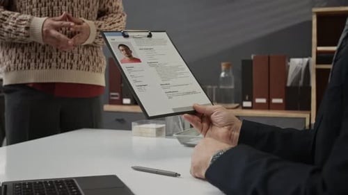 Recruitment Manager Getting Application Form from Young Job Candidate