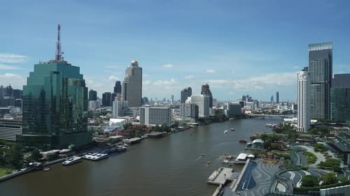 A variety of boat traffic speeds along the Chao Phraya River, Bangkok,Thailand.