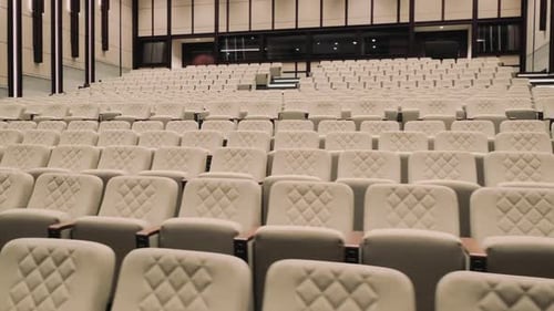 Large empty auditorium with white seats. slow motion.4K
