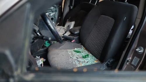 Damaged Car Interior with Broken Glass and Wreckage