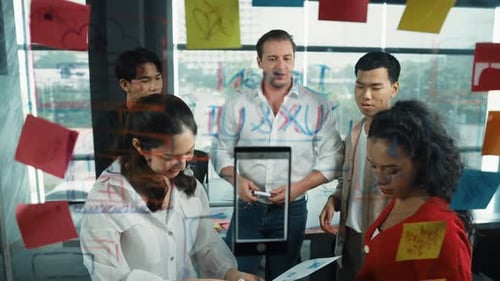 Business team brainstorming marketing idea by using sticky notes. Manipulator.