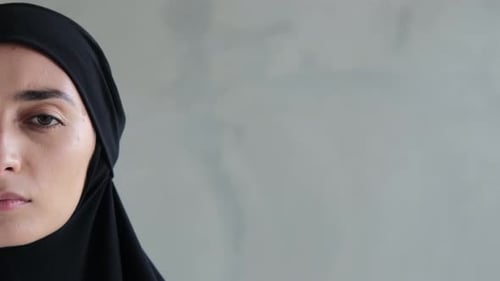 Close-Up of Woman in Black Head Covering